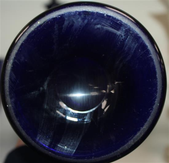 A pair of Bristol blue glass mallet shaped decanters and target stoppers, and a similar panel cut pedestal bowl, first half 19th centur